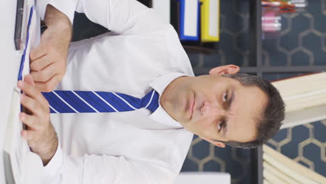 Vertical-video-of-Thoughtful-businessman.